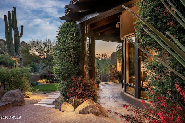 view of patio terrace at dusk