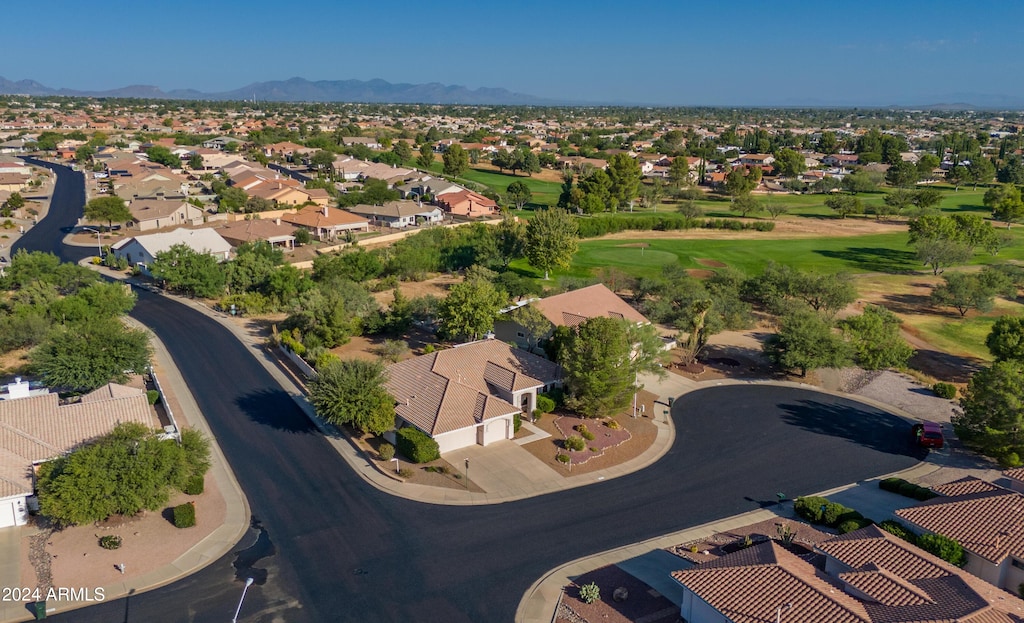 birds eye view of property with a mountain view