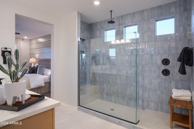 bathroom featuring tile patterned floors and tiled shower