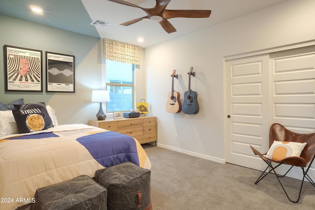 bedroom with ceiling fan, a closet, and carpet