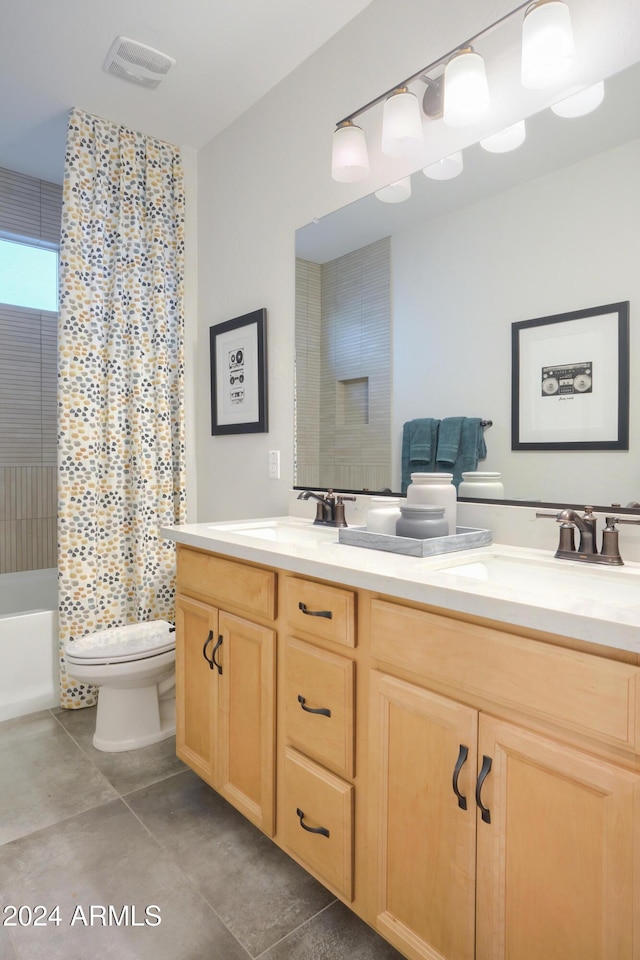 full bathroom featuring tile patterned flooring, vanity, shower / bathtub combination, and toilet