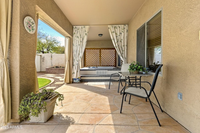 view of patio featuring fence