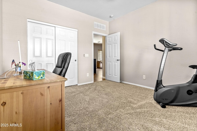 office featuring baseboards, visible vents, and carpet flooring