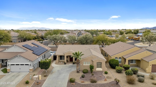 drone / aerial view featuring a residential view and a mountain view