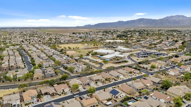 drone / aerial view featuring a residential view and a mountain view