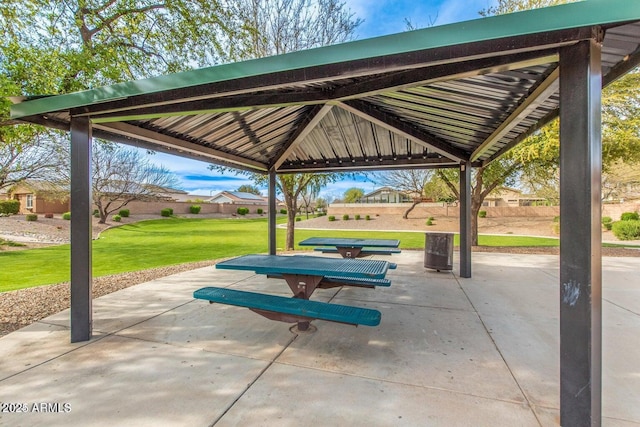 view of community with a patio area, a lawn, and a gazebo