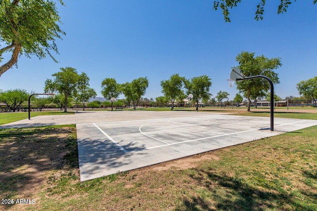 view of sport court featuring community basketball court and a yard