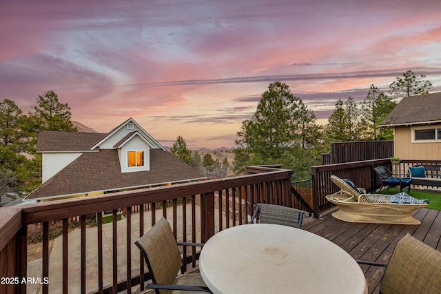 wooden deck featuring outdoor dining space