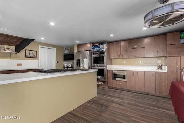 kitchen featuring visible vents, dark wood-style flooring, light countertops, appliances with stainless steel finishes, and recessed lighting
