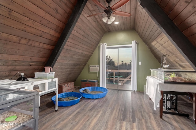 interior space featuring wood ceiling, access to exterior, wood finished floors, vaulted ceiling with beams, and a wall mounted air conditioner