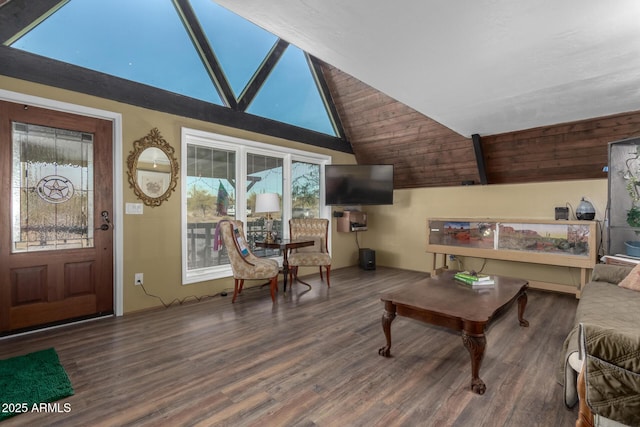 living room featuring wood finished floors and lofted ceiling