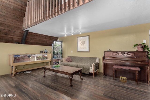 living room with wood finished floors and lofted ceiling