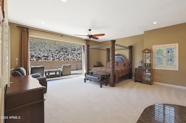 bedroom featuring ceiling fan and light carpet