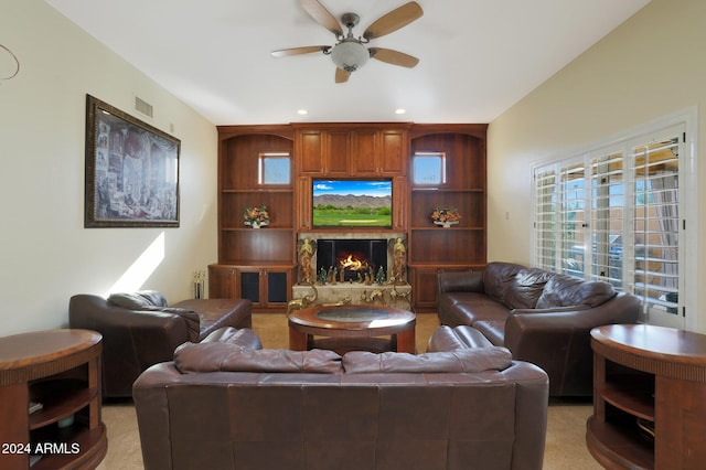 carpeted living room with ceiling fan