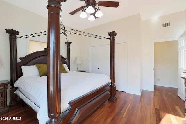 bedroom with ceiling fan, dark hardwood / wood-style flooring, and vaulted ceiling