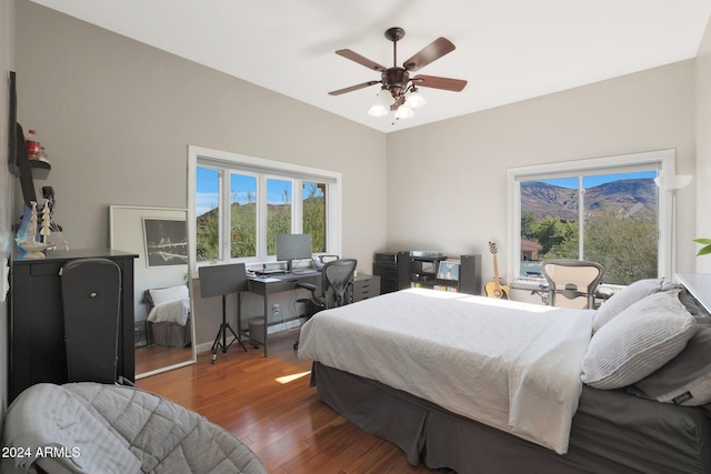 bedroom featuring ceiling fan and dark hardwood / wood-style flooring