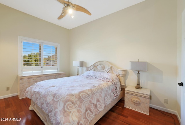 bedroom with ceiling fan and dark hardwood / wood-style flooring