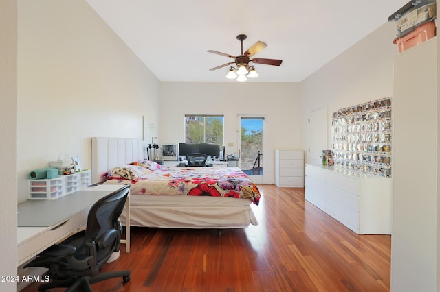 bedroom with access to outside, ceiling fan, and hardwood / wood-style floors