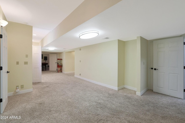 empty room with light colored carpet