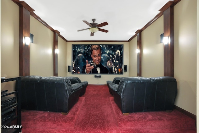 carpeted home theater room featuring ceiling fan and crown molding