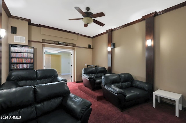 home theater room with dark carpet, ceiling fan, and crown molding