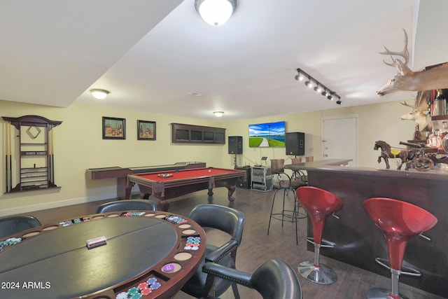 recreation room with indoor bar, rail lighting, dark hardwood / wood-style floors, and pool table