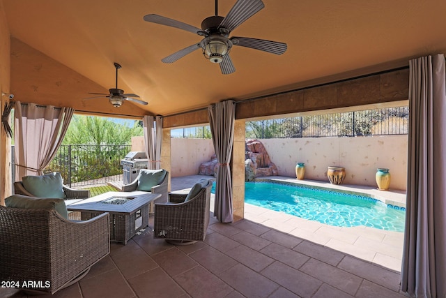 view of pool featuring a grill, ceiling fan, a patio, and a fire pit