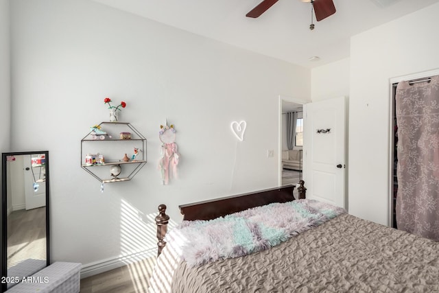 unfurnished bedroom featuring wood finished floors and ceiling fan