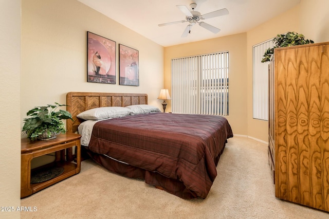 bedroom with carpet flooring, a ceiling fan, and baseboards