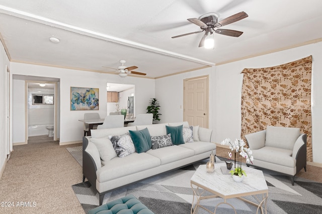 carpeted living room with ornamental molding