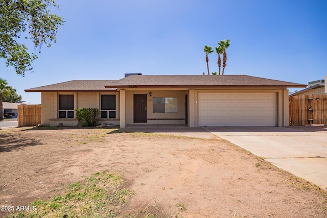 18402 N 17th Ave, Phoenix, AZ 85023 - ranch-style house with a garage, fence, driveway, and stucco siding