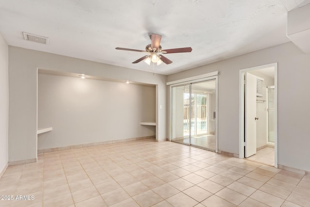 18402 N 17th Ave, Phoenix, AZ 85023 - empty room featuring a ceiling fan, light tile patterned floors, and baseboards