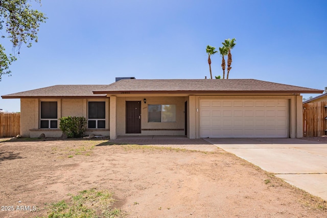 18402 N 17th Ave, Phoenix, AZ 85023 - ranch-style house with fence, a garage, concrete driveway, and stucco siding