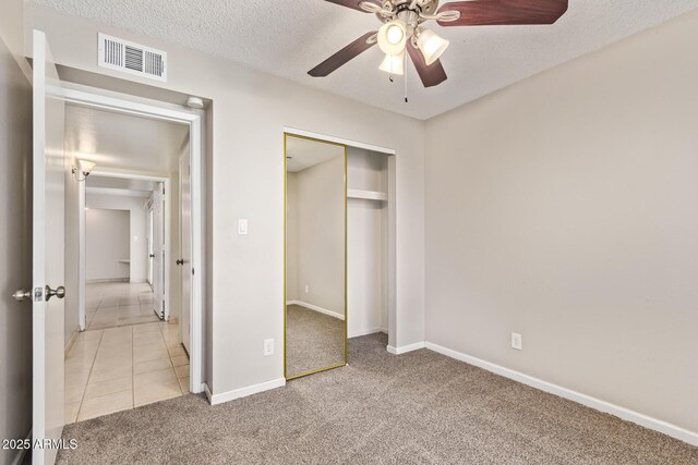 18402 N 17th Ave, Phoenix, AZ 85023 - unfurnished bedroom featuring light colored carpet, a closet, baseboards, a textured ceiling, and a ceiling fan