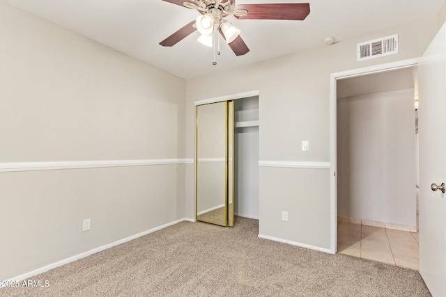 18402 N 17th Ave, Phoenix, AZ 85023 - unfurnished bedroom with carpet flooring, a closet, baseboards, and a ceiling fan