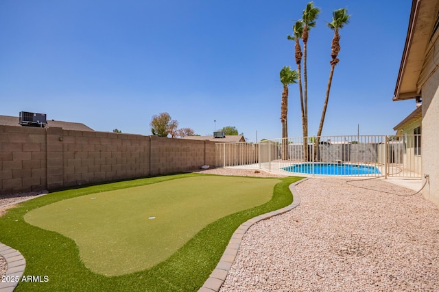 18402 N 17th Ave, Phoenix, AZ 85023 - fenced backyard with a putting area and central AC unit
