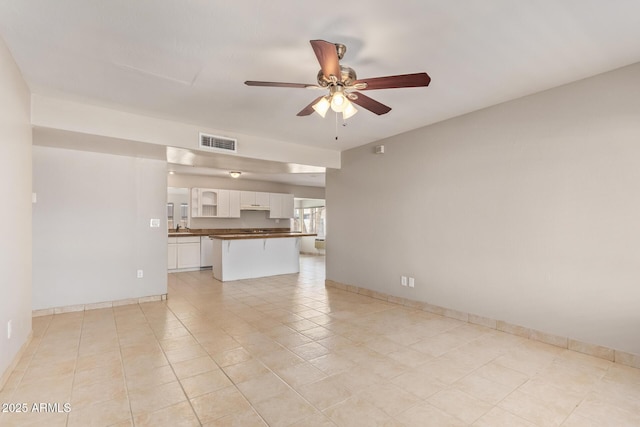 18402 N 17th Ave, Phoenix, AZ 85023 - unfurnished living room with a ceiling fan, light tile patterned flooring, and baseboards