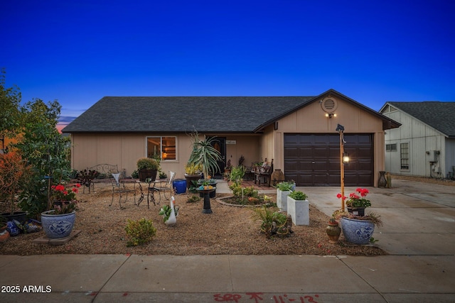 single story home featuring a garage