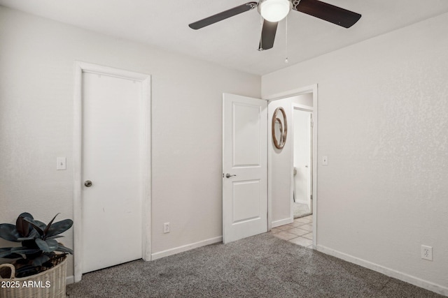 unfurnished bedroom featuring light carpet and ceiling fan