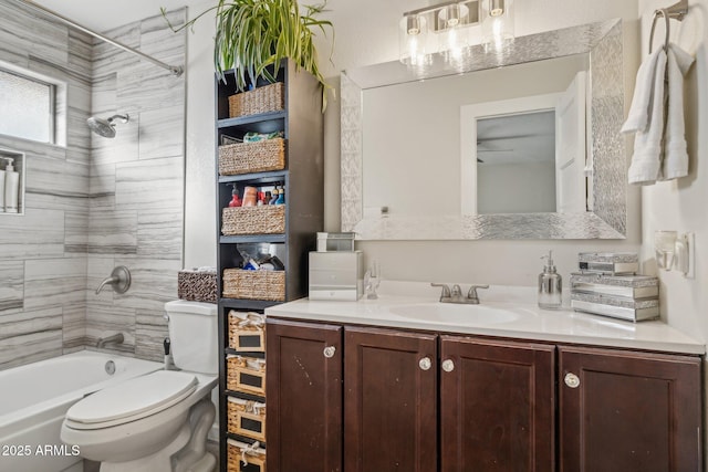 full bathroom with vanity, toilet, and tiled shower / bath combo