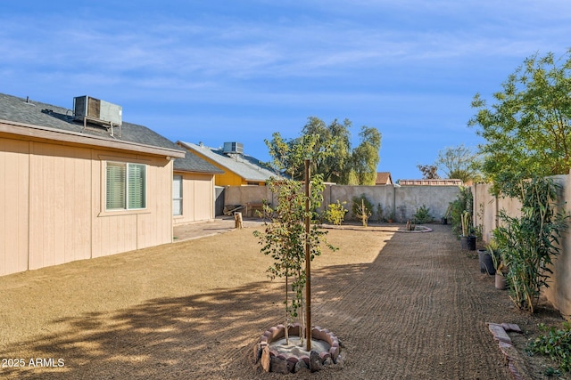 view of yard with central air condition unit