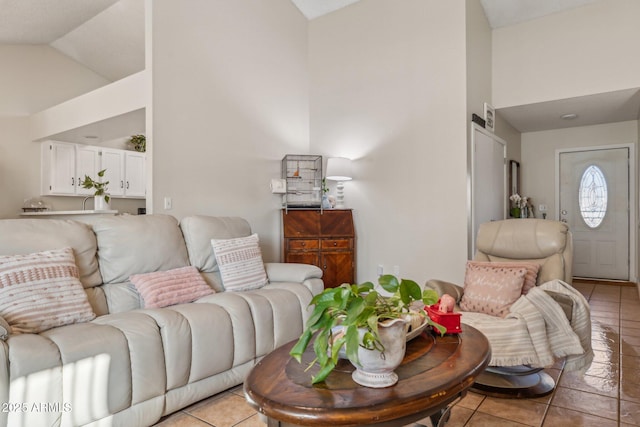 tiled living room with high vaulted ceiling