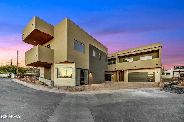 view of front of property featuring a garage