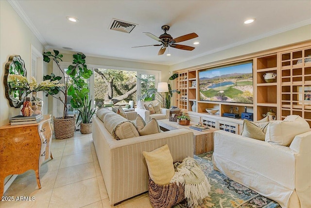 living room featuring ceiling fan, built in features, light tile patterned flooring, and crown molding