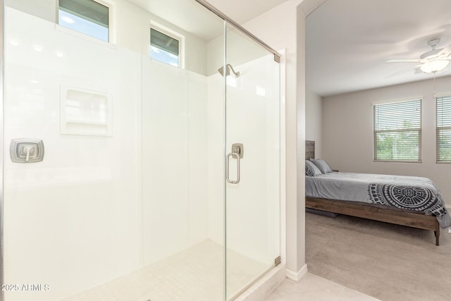 686 N 152nd Dr, Goodyear, AZ 85338 - ensuite bathroom with a stall shower, ensuite bathroom, a ceiling fan, and plenty of natural light