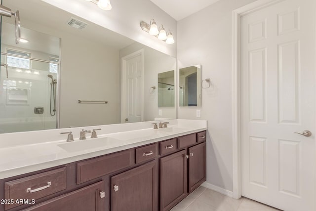 686 N 152nd Dr, Goodyear, AZ 85338 - full bath with a sink, visible vents, tile patterned floors, and a shower with shower door