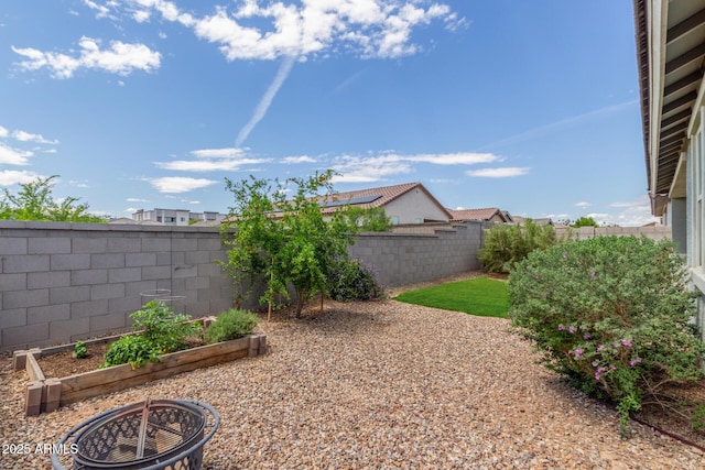 686 N 152nd Dr, Goodyear, AZ 85338 - view of yard featuring a fenced backyard and a vegetable garden
