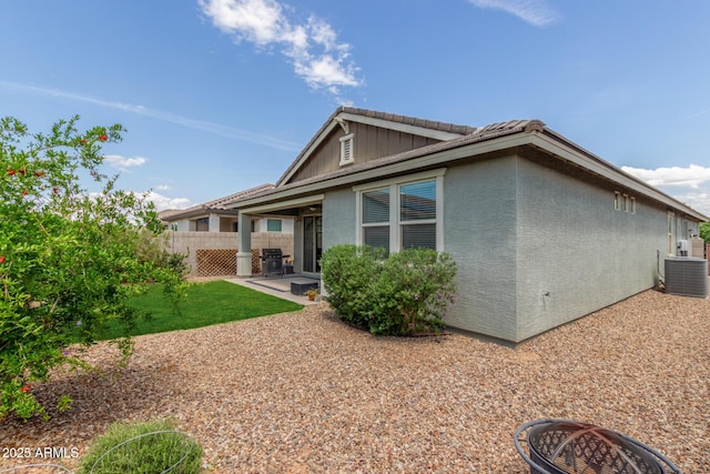 686 N 152nd Dr, Goodyear, AZ 85338 - back of house with stucco siding, cooling unit, board and batten siding, a patio area, and fence