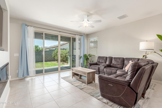 686 N 152nd Dr, Goodyear, AZ 85338 - living area with visible vents, baseboards, light tile patterned flooring, and ceiling fan