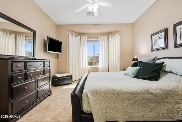 bedroom featuring light tile patterned floors, a ceiling fan, and visible vents